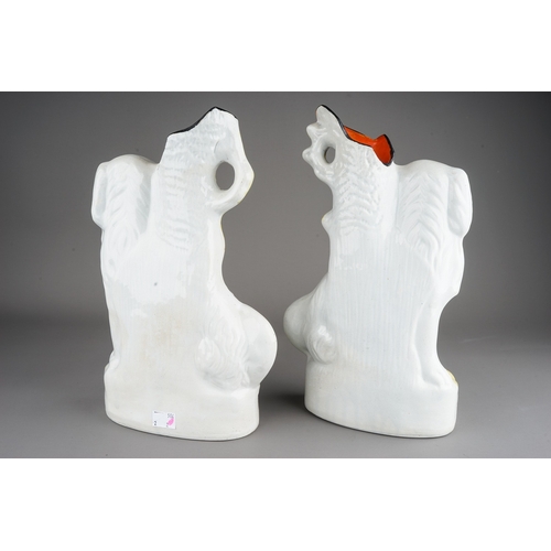 416 - A pair of Staffordshire large flatback spill vases modelled as large white Spaniels, approx 33cm at ... 