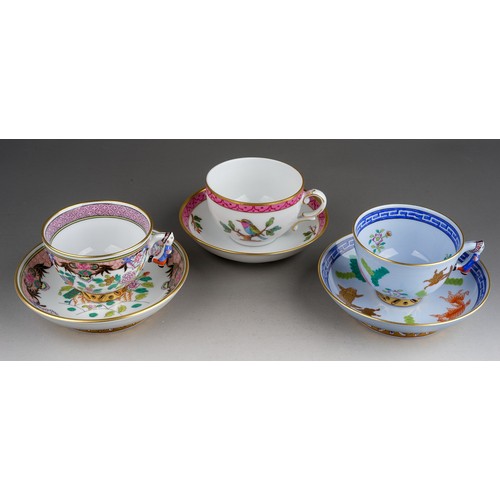 461 - Two Herend Chinoiserie coffee cups and saucers, one with blue ground decorated with three fish and f... 