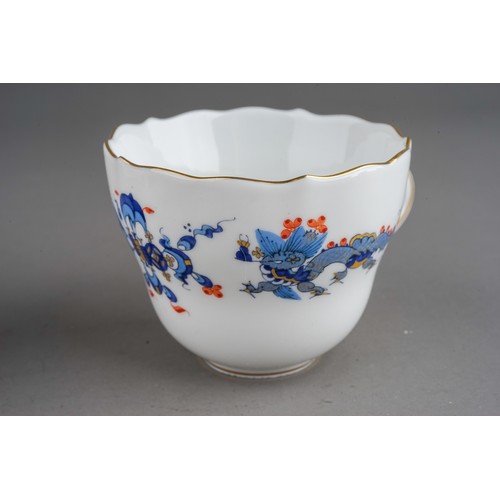 469 - A set of three Meissen Chinoiserie Dragon coffee cups and saucers, each cup with wavy rim and gilt h... 