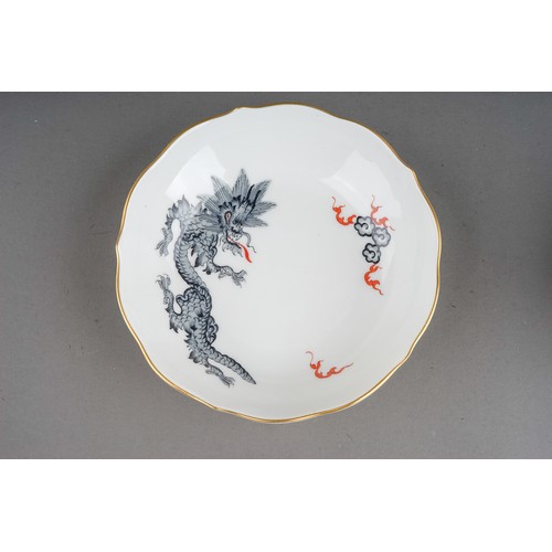 469 - A set of three Meissen Chinoiserie Dragon coffee cups and saucers, each cup with wavy rim and gilt h... 