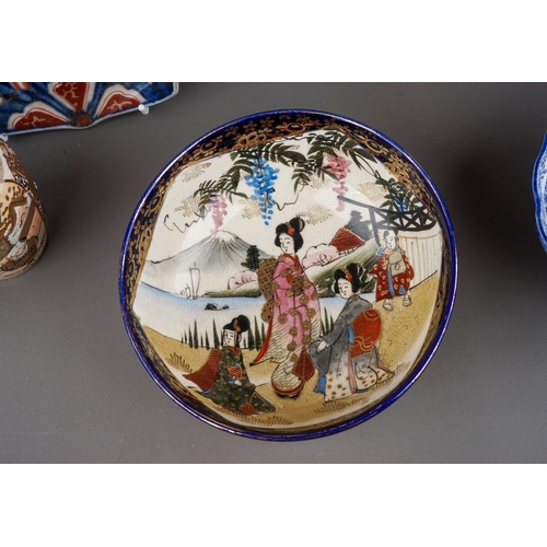 477 - Two Chinese Imari scalloped dishes, one decorated with lion jumping on a balcony, the other with flo... 