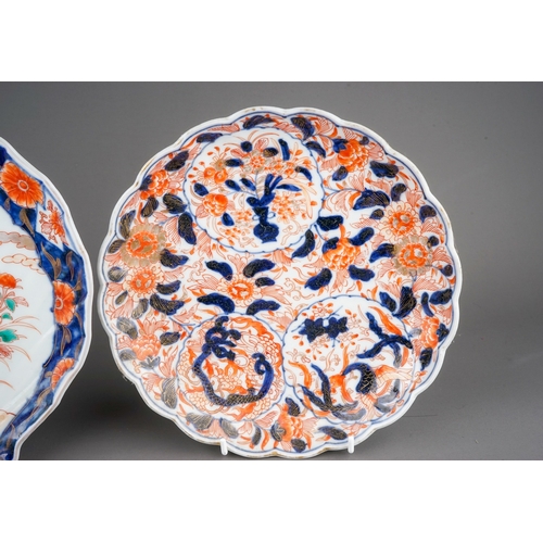 477 - Two Chinese Imari scalloped dishes, one decorated with lion jumping on a balcony, the other with flo... 