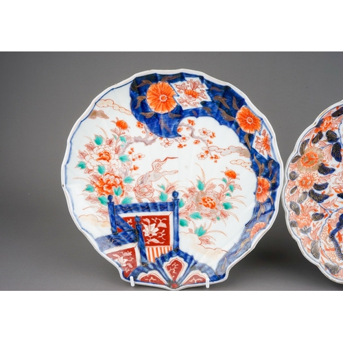 477 - Two Chinese Imari scalloped dishes, one decorated with lion jumping on a balcony, the other with flo... 