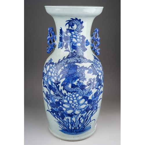 480 - A Chinese blue and white baluster vase decorated with central four claw dragon hiding amongst flower... 