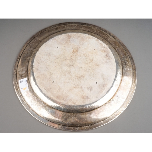 555 - A 19th Century Danish silver dinner plate with gadroon rim, the raised border with the Danish Royal ... 