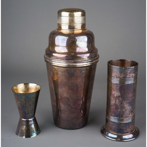 564 - An EPNS cocktail shaker, stamped to underside together with a spirit measure and a plated Trench art... 