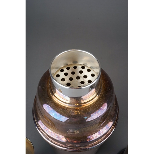 564 - An EPNS cocktail shaker, stamped to underside together with a spirit measure and a plated Trench art... 