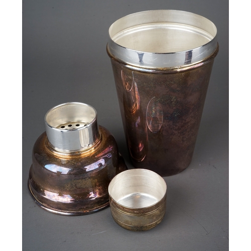 564 - An EPNS cocktail shaker, stamped to underside together with a spirit measure and a plated Trench art... 