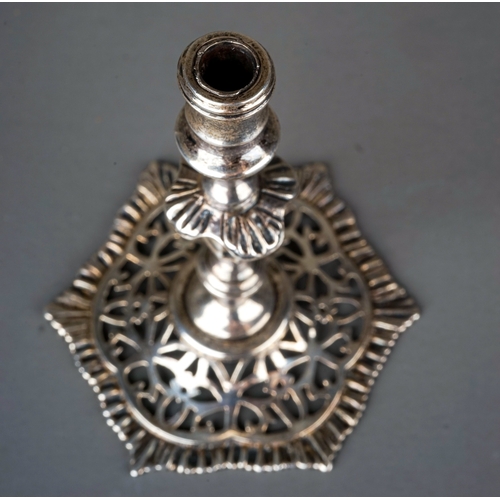 566 - A late Victorian silver taperstick, on hexagonal reticulated base, hallmarked by B.D., London, 1898,... 