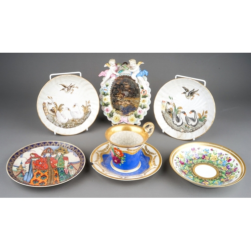 328A - A group of Continental porcelain to include: two early 20th Century Dresden Swan Service circular di... 