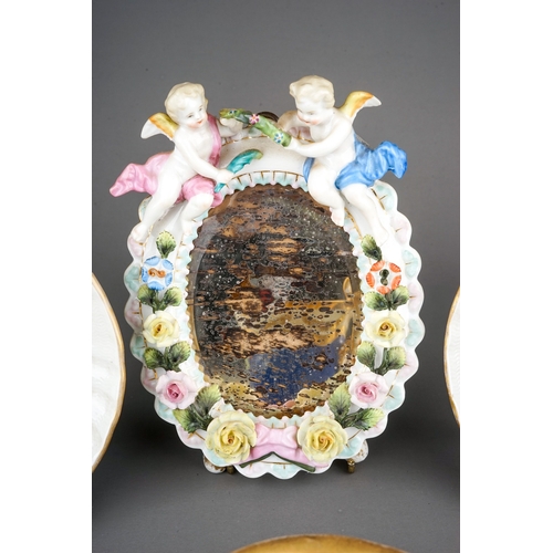 328A - A group of Continental porcelain to include: two early 20th Century Dresden Swan Service circular di... 