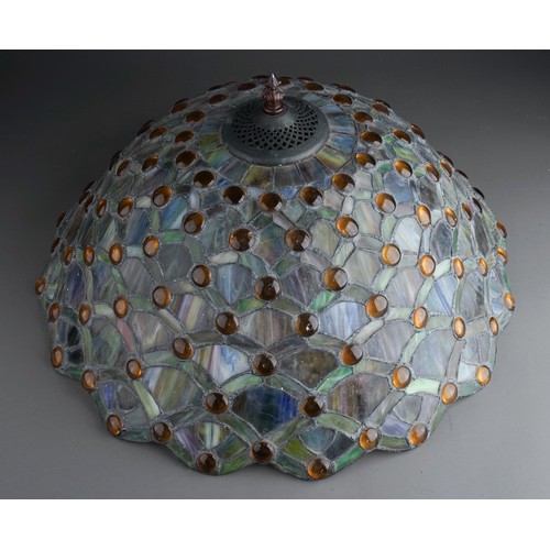 508A - A Continental Tiffany style stained glass lamp stylised fan decoration to shade and stand with amber... 