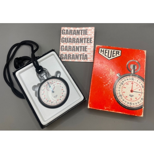 306A - Boxed Heuer stopwatch, in original box with paperwork