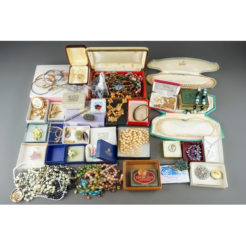 18 - A large collection of costume jewellery, including brooches, chains, beads, faux pearls, etc