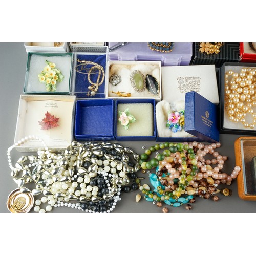 18 - A large collection of costume jewellery, including brooches, chains, beads, faux pearls, etc