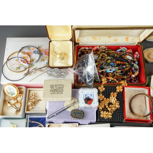 18 - A large collection of costume jewellery, including brooches, chains, beads, faux pearls, etc