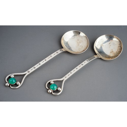 184A - A pair of Arts & Crafts silver spoons, stylised heart shaped openwork terminals with jade coloured c... 