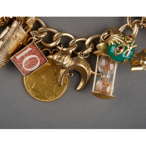 13 - A 9ct yellow gold charm bracelet, suspending a 1909 sovereign and two half sovereigns 1911/1914, and... 