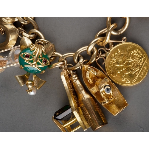 13 - A 9ct yellow gold charm bracelet, suspending a 1909 sovereign and two half sovereigns 1911/1914, and... 