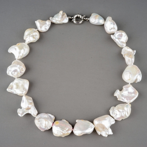 15 - A baroque pearl necklace, white metal clasp, approx 45.6cm long