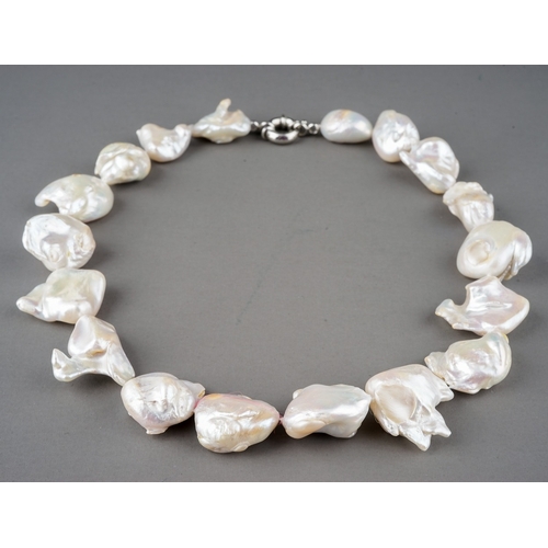 15 - A baroque pearl necklace, white metal clasp, approx 45.6cm long