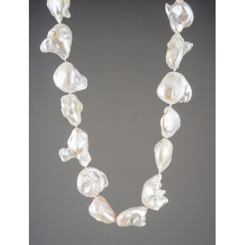 15 - A baroque pearl necklace, white metal clasp, approx 45.6cm long