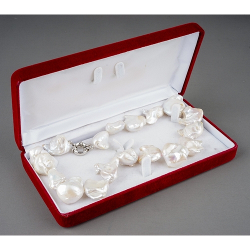 15 - A baroque pearl necklace, white metal clasp, approx 45.6cm long