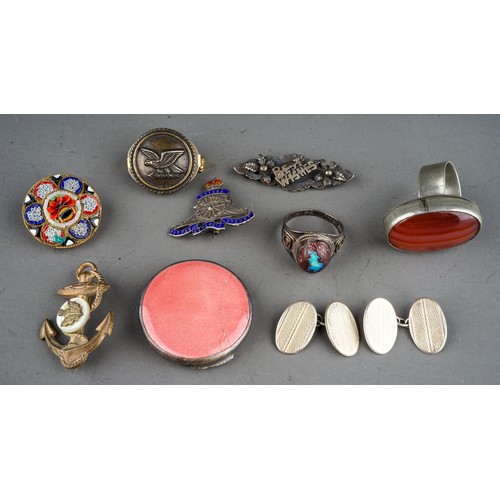 25 - A small collection of silver and costume jewellery, including a silver brooch in the form of a seate... 