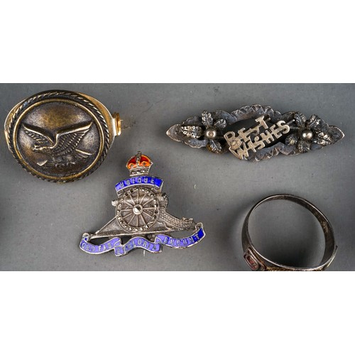 25 - A small collection of silver and costume jewellery, including a silver brooch in the form of a seate... 