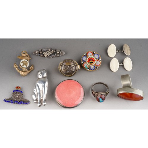 25 - A small collection of silver and costume jewellery, including a silver brooch in the form of a seate... 