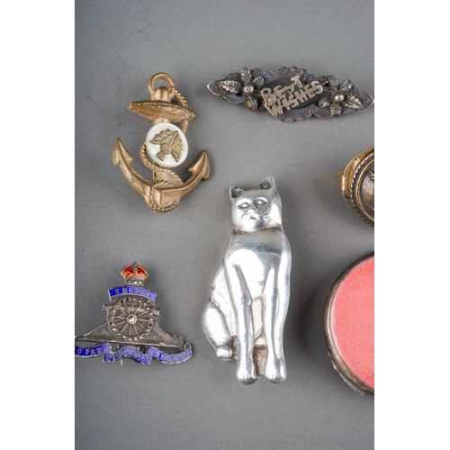 25 - A small collection of silver and costume jewellery, including a silver brooch in the form of a seate... 