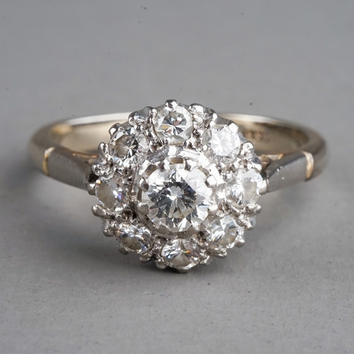 29 - An 18ct white gold and diamond cluster ring, the centre diamond approx 0.2ct within a border of smal... 