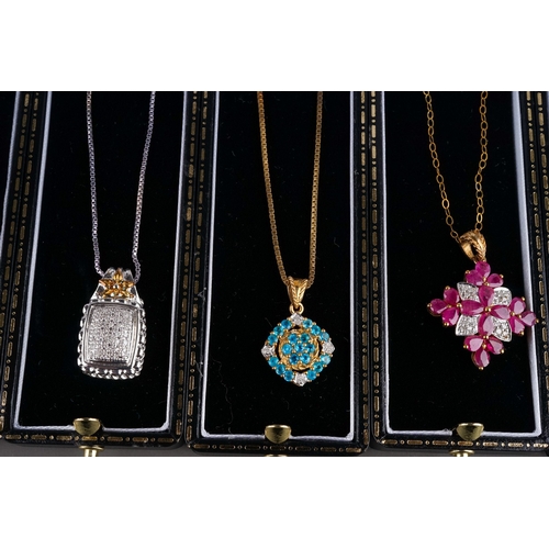 52 - A collection of silver gem-set pendant necklaces, including peridot and marcasite, ruby, CZ etc (9)