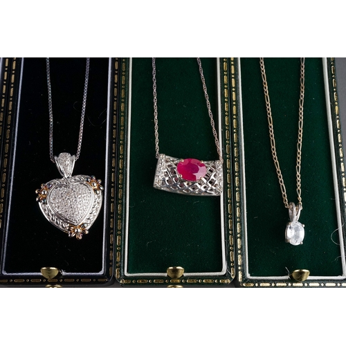 52 - A collection of silver gem-set pendant necklaces, including peridot and marcasite, ruby, CZ etc (9)