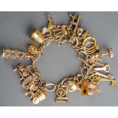 54 - 9 ct gold charm bracelet, gross weight 43.3g,