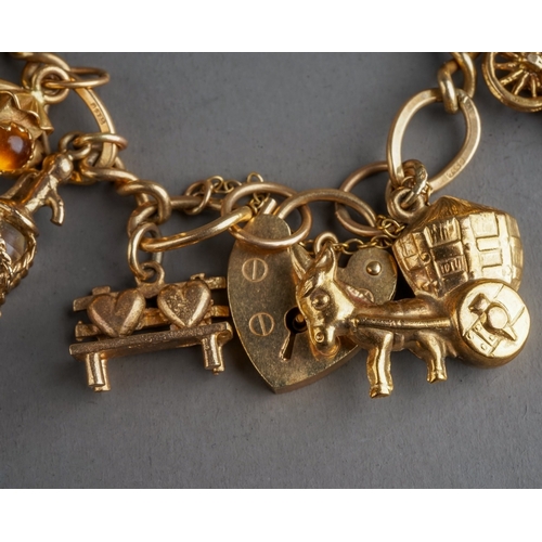 54 - 9 ct gold charm bracelet, gross weight 43.3g,