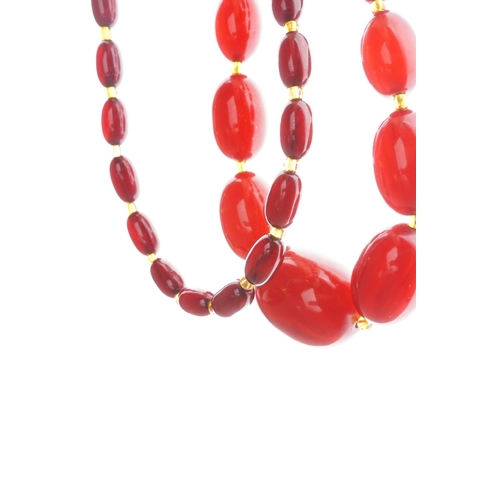 60 - Two Cherry Amber Necklaces, total weight 64g