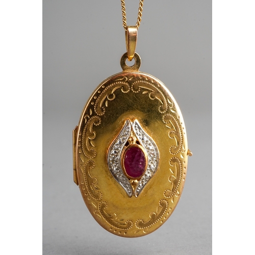 71 - Gold locket with red and white stones to centre  and chain, marked 9 ct, gross weight 8g. Centre red... 