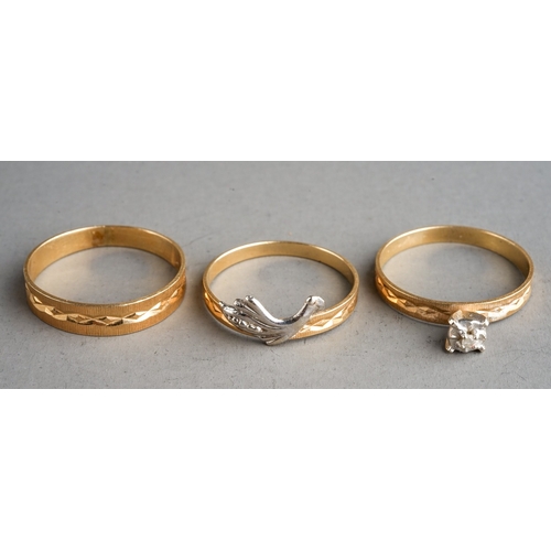 72 - Trio of yellow metal rings, centre ring marked for 14 ct, gross weight 3.5g