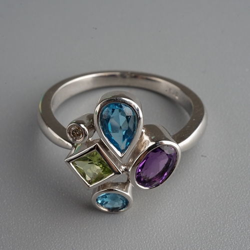 77 - 9 ct white gold ring set with amethyst, blue topaz, peridot and a  diamond ( gross weight 4.1g)