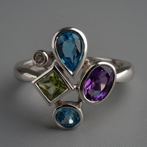 77 - 9 ct white gold ring set with amethyst, blue topaz, peridot and a  diamond ( gross weight 4.1g)