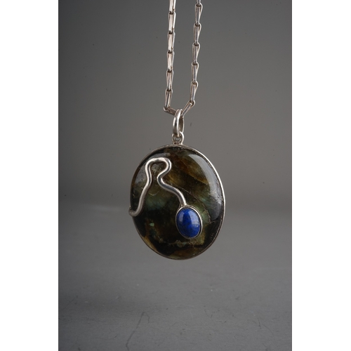 87 - Silver and Lapiz Lazuli pendant set in silver on a silver chain.