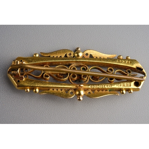 88 - 15ct gold  bar brooch set with 3 diamond chips. Gross weight 3.3g