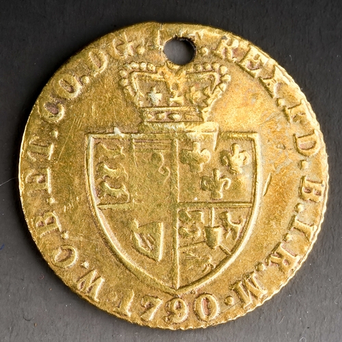 101 - A George III yellow metal coin, dated 1790, pierced, approx 2.3g