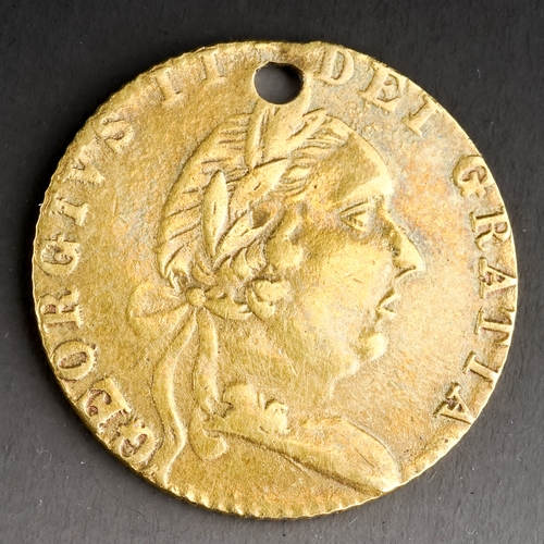 101 - A George III yellow metal coin, dated 1790, pierced, approx 2.3g