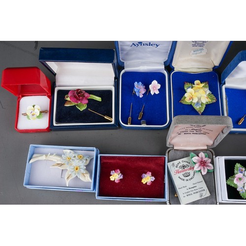 107 - 13 boxed porcelain brooches , earrings and pins to include Aynsley, Coalport, Hammersley ( 1 bag)