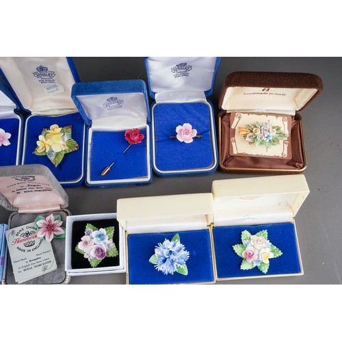 107 - 13 boxed porcelain brooches , earrings and pins to include Aynsley, Coalport, Hammersley ( 1 bag)