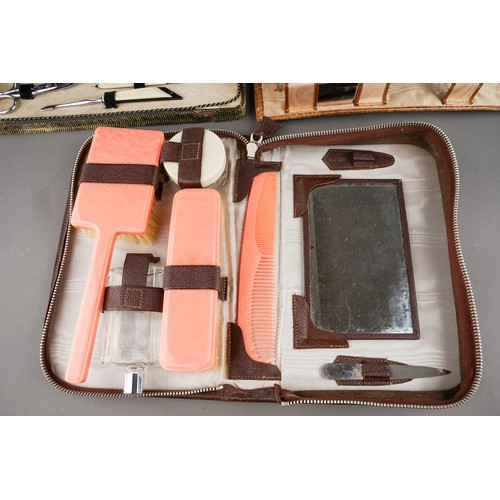 115 - Two various vintage circa 1930s travelling cases, with mirrors, bakelite brushes or chrome mounted b... 