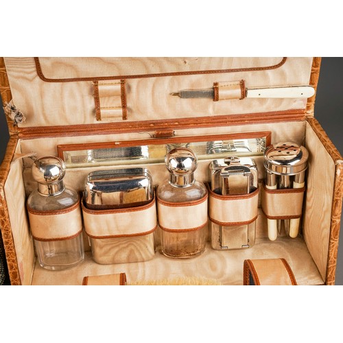 115 - Two various vintage circa 1930s travelling cases, with mirrors, bakelite brushes or chrome mounted b... 