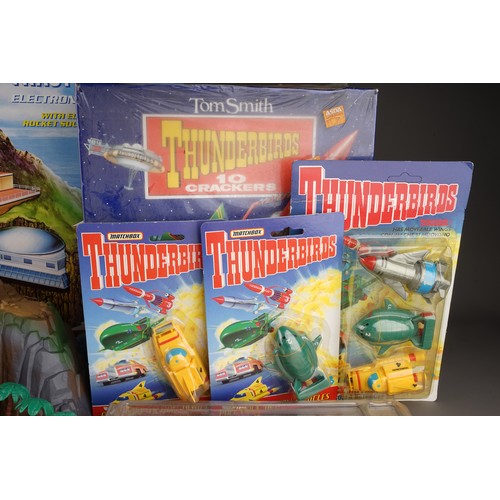 120 - Collection of Thunderbirds toys to include boxed Tracy island, crackers, figures, posters, coins, di... 